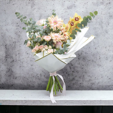 Morning Sun Delight, Cymbidium, Gerbera, Spray Rose, Rose Pink, Eucalyptus, White Wrapping